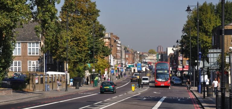 Photo of Tottenham with people walking, cycling, and driving.