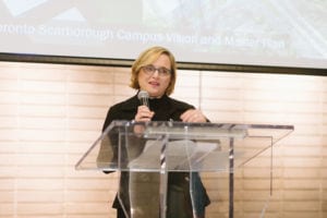 Person making a speech and the podium.