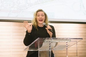 Person making a speech and the podium.