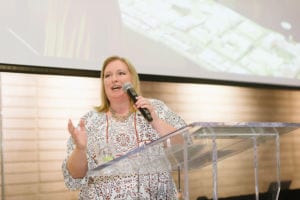 Person making a speech and the podium.