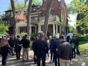 Group of people outside of a house