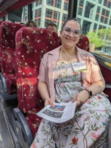 Person sitting on a coach bus chair